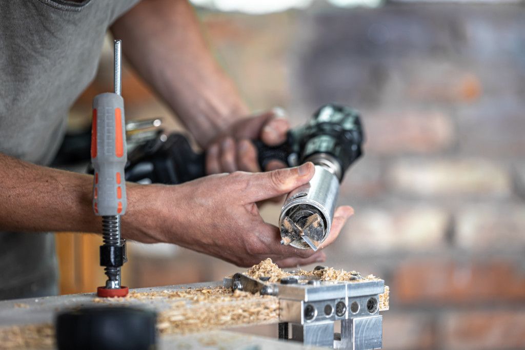 professional-carpenter-working-with-a-hinge-drill-working-with-wood.jpg